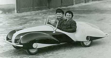 Son of manufacture owner Josef III. Sodomka (behind wheel) with his friend Jiri Popelka on ride.